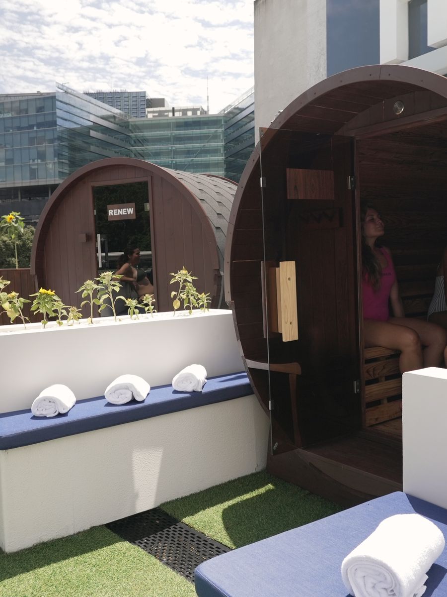 One of the two barrel saunas on the rooftop at Renew, door open
